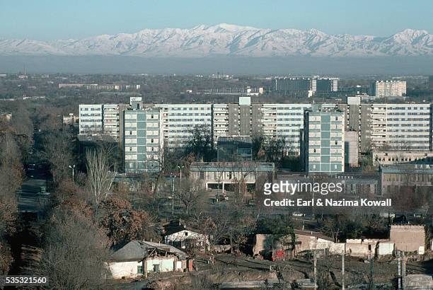 pamir mountains looming over dushambe - dushanbe stock pictures, royalty-free photos & images