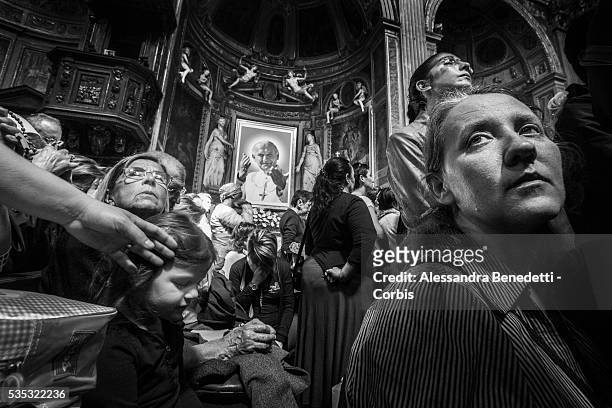 Pilgrims and faithful pray in the Church of S.Spirito in Sassia, dedicated to John Paul one day before the historical canonzation of Jonh Paul II and...