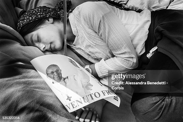 Pilgrims gather in St. Peter's Square one day before the historical canonzation of Jonh Paul II and John XXIII.The double canonisation of two of...