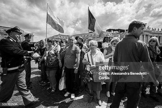 Black & White Portfolio: Pilgrims gather in St. Peter's Square one day before the historical canonzation of Jonh Paul II and John XXIII.The double...