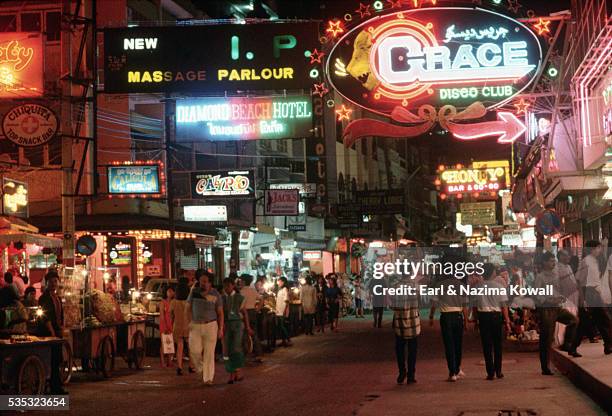 red light district on pattaya beach road - pattaya stock-fotos und bilder