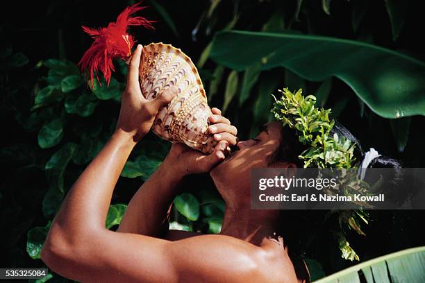 Conch Blowing Photos and Premium High Res Pictures - Getty Images
