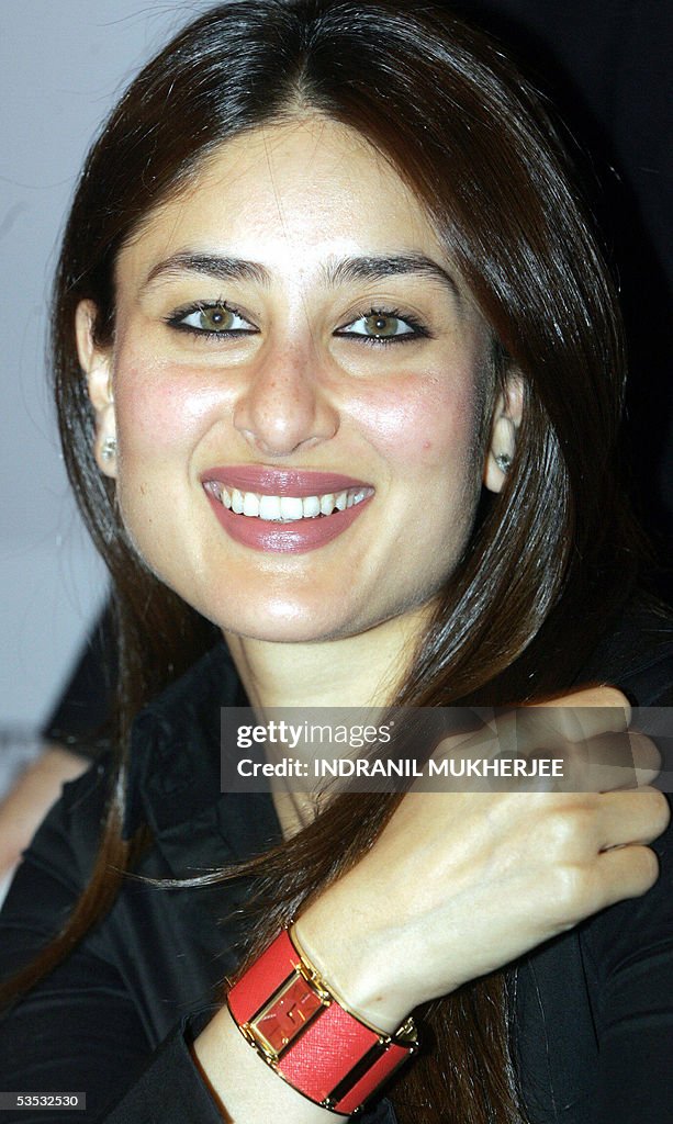 Indian actress Kareena Kapoor listens to