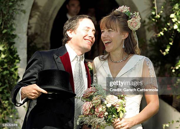 Musician Jools Holland and Christabel McEwen pose at their wedding at St James's Church, on August 30, 2005 in Cooling, England. The Archbishop Of...