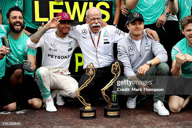 Lewis Hamilton of Great Britain and Mercedes GP celebrates his win with Dieter Zetsche, Chairman of the Board of Directors of Daimler AG and Head of...
