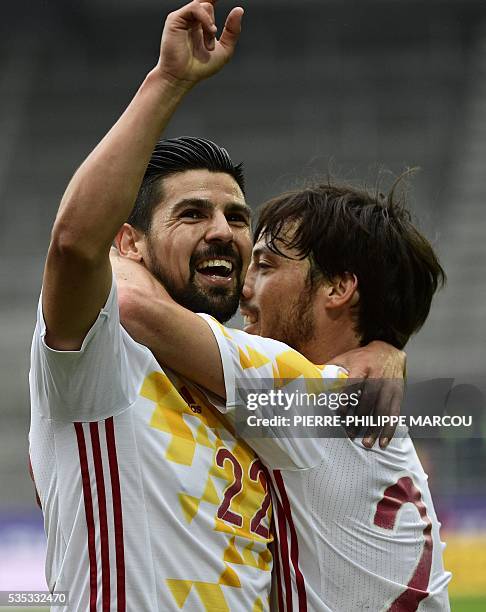 Spain's midfielder Nolita celebrates after winning the friendly football match Spain versus Bosnia at the AFG Arena in St. Gallen on May 29, 2016 in...