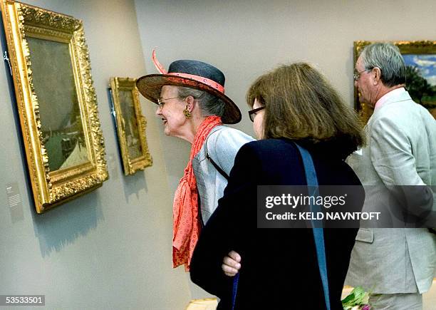 Queen Margrethe and Prince Consort Henrik of Denmark are escorted by curator Anne-Birgitte Fonsmark, during the opening of an exhibition with early...