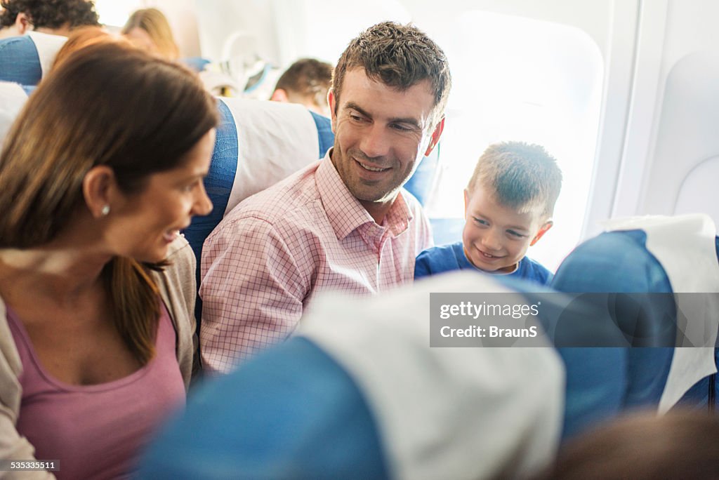 Family communicating in a plane.