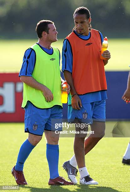 Wayne Rooney and Rio Ferdinand chat during the England Training Session at London Colney on August 30, 2005 in London Colney, England.