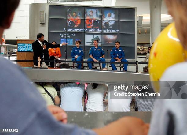 Youngsters listen to Dr. Neil deGrasse question NASA astronauts Eileen Collins, Stephen Robinson, and Charles Camarda during an appearance at the...