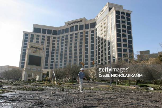 Biloxi, UNITED STATES: The Beau Rivage stands in the background as a man walks among the destruction in Biloxi, Mississppi, 30 August 2005 after...