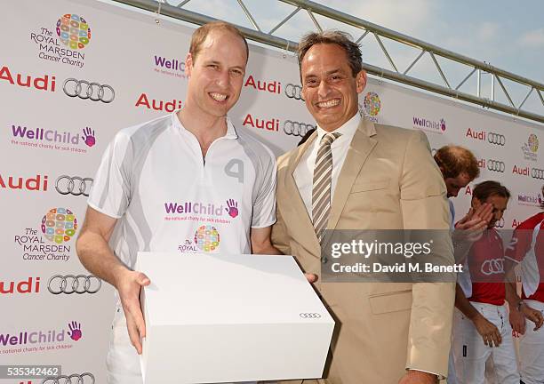 Prince William, Duke of Cambridge, and Andre Konsbruck, Director of Audi UK, attend day two of the Audi Polo Challenge at Coworth Park on May 29,...