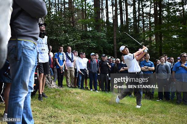 South Korean golfer An Byeong-hun plays from the rough on the 15th hole during the fourth day of the golf PGA Championship at Wentworth Golf Club in...