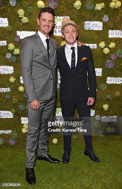 Justin Rose and Niall Horan arrive for The Horan And Rose event at The Grove on May 29, 2016 in Watford, England.