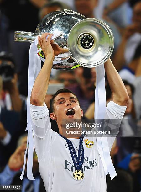 Cristiano Ronaldo of Real Madrid celebrates wth the trophy after victory in the UEFA Champions League Final match between Real Madrid and Club...