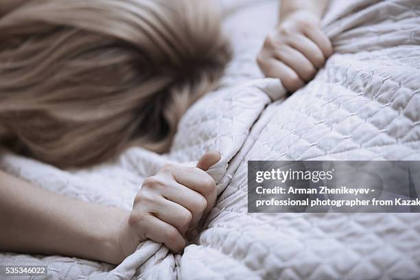 passionate woman gapping bed linen - gripping bedsheets stock pictures, royalty-free photos & images