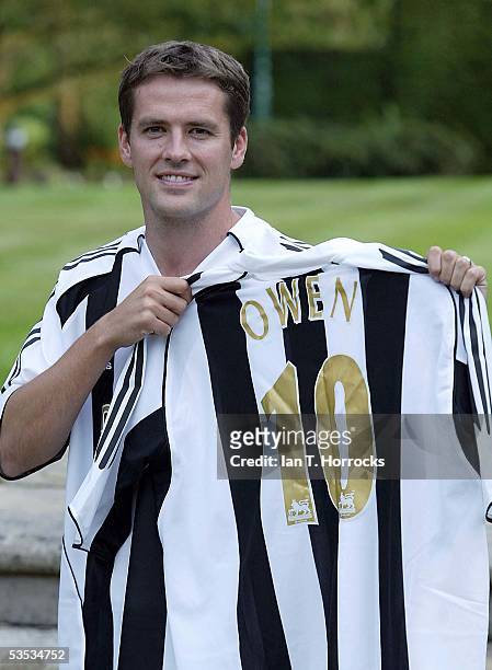 Michael Owen poses after signing for Newcastle United at his home on August 30, 2005 in North Wales.
