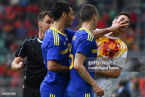 Emir Spahic of Bosnia slaps Cesar Azpilicueta of Spain during an international friendly match between Spain and Bosnia at the AFG Arena on May 29,...