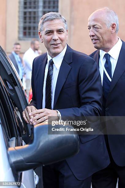 George Clooney leaves at the end of 'Un Muro o Un Ponte' Seminary held by Pope Francis at the Paul VI Hall on May 29, 2016 in Vatican City, Vatican.