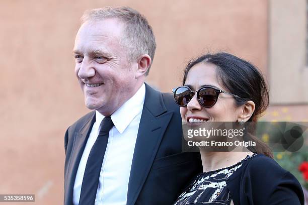 Salma Hayek, Francois-Henri Pinault leave at the end of 'Un Muro o Un Ponte' Seminary held by Pope Francis at the Paul VI Hall on May 29, 2016 in...