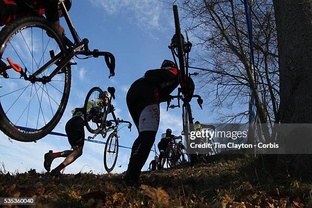 Competitors in action as they climb a hill in the Men's Category 4/5 race during the The 3rd Annual Newtown Cyclocross Race in the Fairfield Hills...