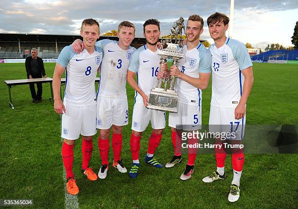 James Ward-Prowse, Matthew Targett, Matthew Grimes, Calum Chambers and John Swift of England pose with the trophy during the Final of the Toulon...