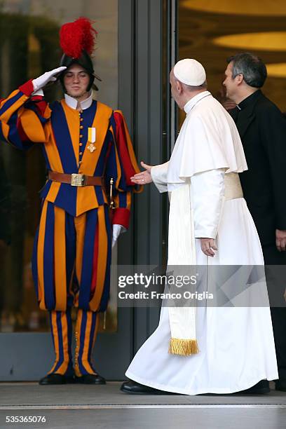 Pope Francis greets a Swiss Guard as he leaves at the end of 'Un Muro o Un Ponte' Seminary held by Pope Francis at the Paul VI Hall on May 29, 2016...