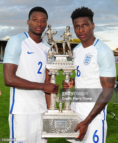 Dominic Iorfa and Kourtney Huase of England pose with the trophy during the Final of the Toulon Tournament between England and France at Parc Des...