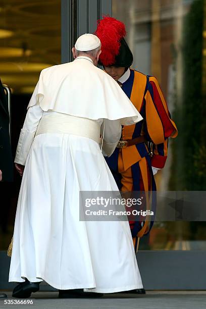 Pope Francis greets a Swiss Guard as he leaves at the end of 'Un Muro o Un Ponte' Seminary held by Pope Francis at the Paul VI Hall on May 29, 2016...