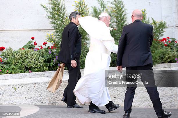 Pope Francis leaves at the end of 'Un Muro o Un Ponte' Seminary held by Pope Francis at the Paul VI Hall on May 29, 2016 in Vatican City, Vatican.
