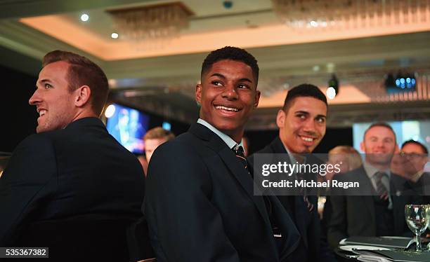 Harry Kane, Marcus Rashford and Chris Smalling look on during the England Footballers Foundation charity event at Sopwell House on May 29, 2016 in St...