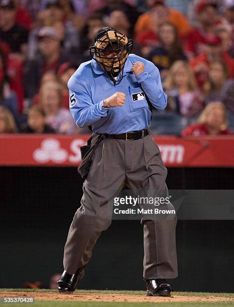 Umpire Dale Scott signals an out call during the game between the Los Angeles Angels of Anaheim and the Baltimore Orioles at Angel Stadium of Anaheim...