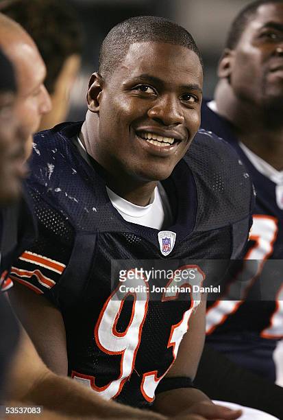 Adewale Ogunleye of the Chicago Bears looks on from the bench during the game against the Buffalo Bills on August 26, 2005 at Soldier Field in...