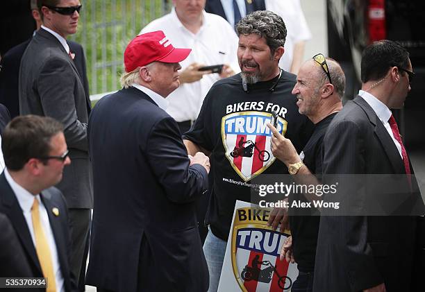 Republican presidential candidate Donald Trump greets with unidentified members of Bikers for Trump during the annual Rolling Thunder First Amendment...