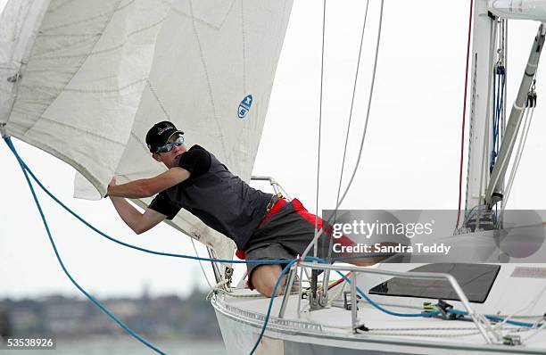 Brad Marsh holds the sail as they prepare for a start during the 2004 New Zealand Match Racing Championships, in the Auckland Harbour, November 25th,...