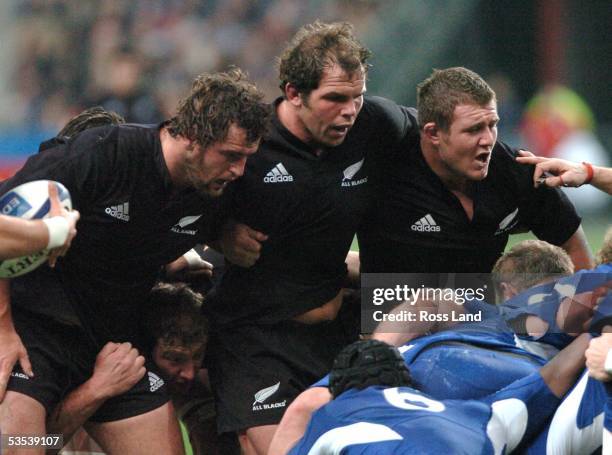 The All Black front row, Carl Hayman , Anton Oliver and Tony Woodcock prepare to pack down during their 456 win over France at Stade de France,...