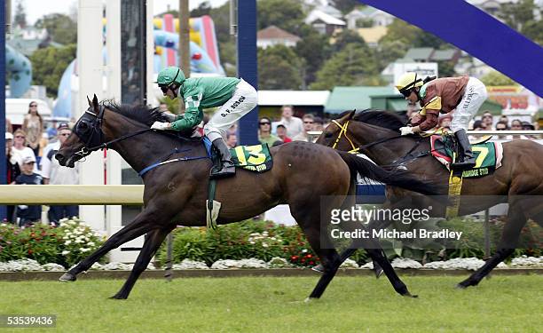 Jockey Opie Bosson rides Spin N Grin to victory ahead of Lisa Allpress on Vamperalla in race 5 the Cambridge Stud Eight Carat Classic at Derby Day at...