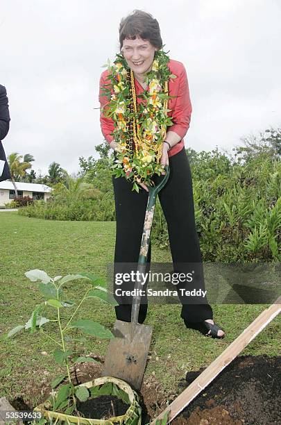 New Zealand Prime Minister Helen Clark plants a Tomanu tree on the section of crown land desiginated as the site for developing the integrated Taoga...