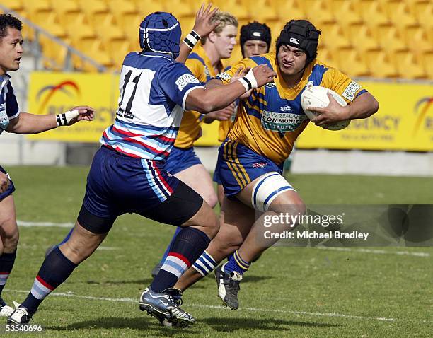 Mt Albert's Mathew Asaou looks to fend off Otahuhu's Slalii Tufeao during the Bartercard Cup preliminary final rugby league match at Ericsson...