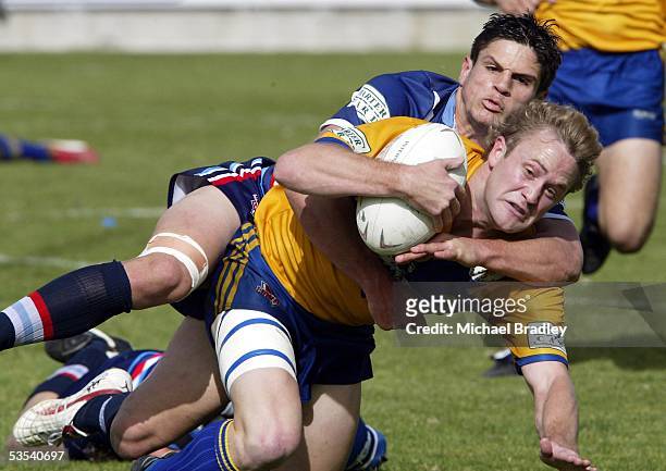 Mt Albert's Kevin Wright dives over for a try in the tackle of Otahuhu's Paul Atkon during the Bartercard Cup preliminary final rugby league match at...