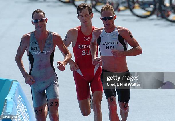 New Zealand's Hamish Carter leads his teammate Bevan Docherty with Sweden's Sven Riederer who finished 3rd in behind in the Mens Triathlon at the...