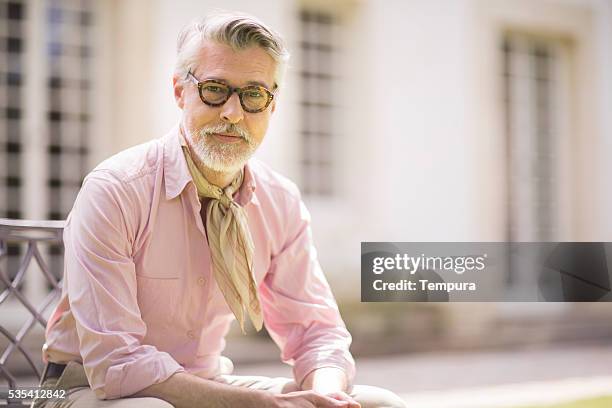 portrait of handsome man looking at camera. - fine art portrait stockfoto's en -beelden