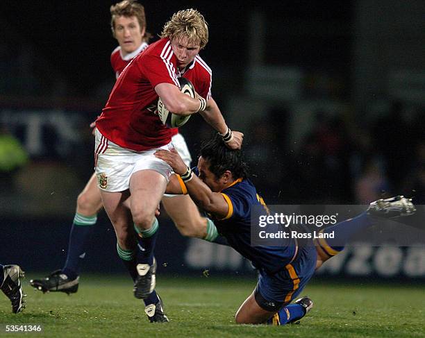 Ollie Smith runs through the tackle of Seilala Mapusua, during the British and Irish Lions 3019 win over Otago in their 5th rugby tour match against...