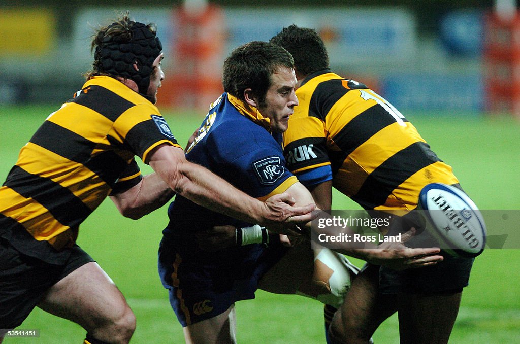 Replacement Sam Harding slips a pass in the tackle of hooker Andrew ...