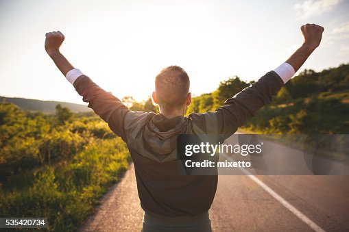 Man raising arms Man raising arms