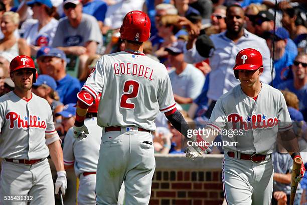 Tyler Goeddel of the Philadelphia Phillies is congratuated by David Lough after hitting a one run home run against the Chicago Cubs during the...