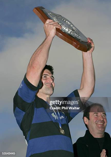 Ponsonby's captain Brett Williams holds the Gallaher Shield as Ponsonby celebrate their 1917 win over Waitakere in the Gallaher Shield Final at Eden...