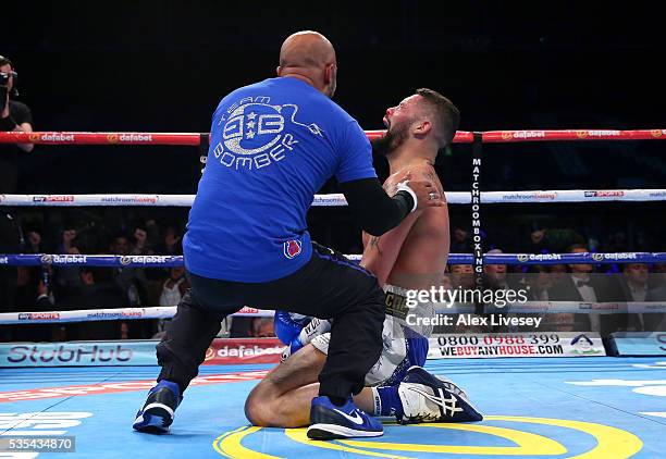 Tony Bellew celebrates with his trainer Dave Coldwell after stopping Illunga Makabu in the second round to win the Vacant WBC World Cruiserweight...