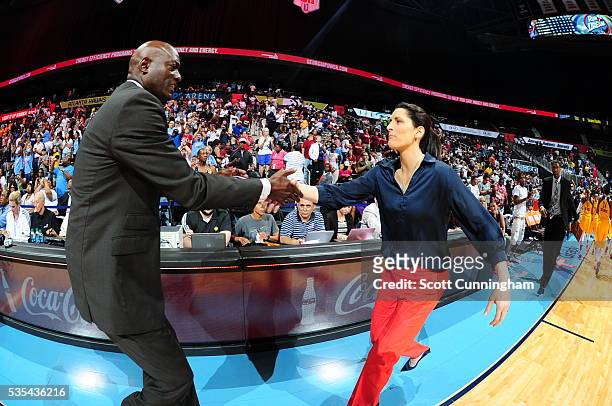 Head coach Michael Cooper of the Atlanta Dream and head coach Stephanie White of the Indiana Fever shake hands after the game on May 29, 2016 at...