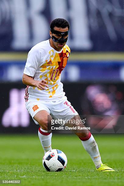 Pedro Rodriguez of Spain runs with the ball during an international friendly match between Spain and Bosnia at the AFG Arena on May 29, 2016 in St...